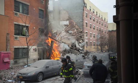 Firefighters work the scene of an explosion that destroyed two apartment buildings in the East Harlem neighborhood of New York.