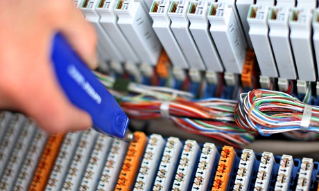 A BT engineer connects customers to high-speed fibre-optic broadband