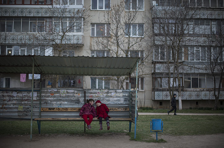 20 photos: Ukrainian girls sit at a bus stop