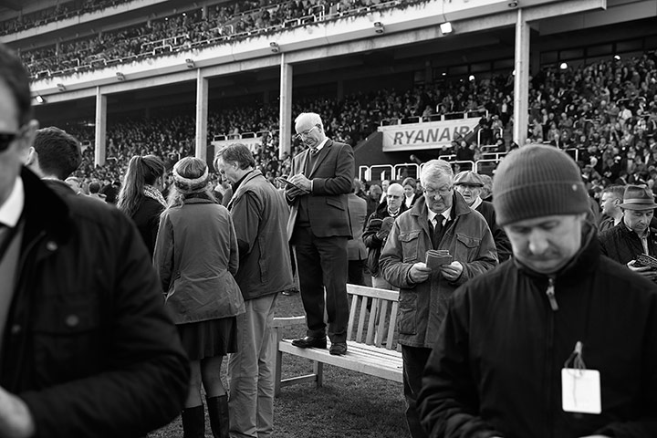 Cheltenham in b/w: Jotting down the winners after a race