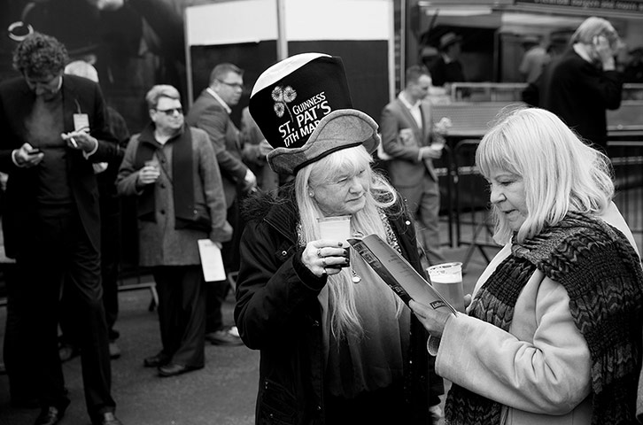 Cheltenham in b/w: Fan drinking a pint