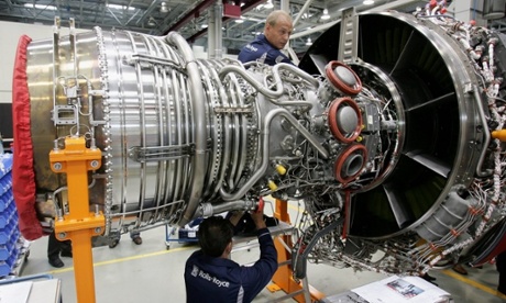 Workers assemble an aircraft jet engineat the Rolls-Royce aircraft engine factory in Berlin.