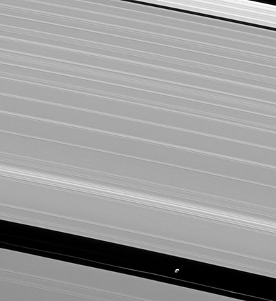 Solar system moons: Pan orbiting among Saturn’s rings