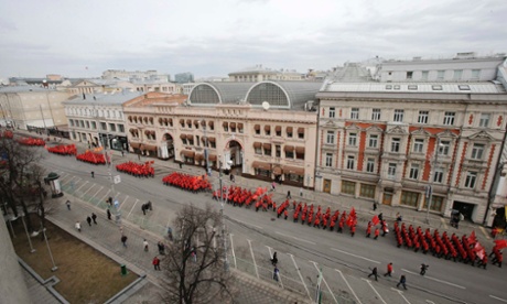 People march in formation as they participate in the 