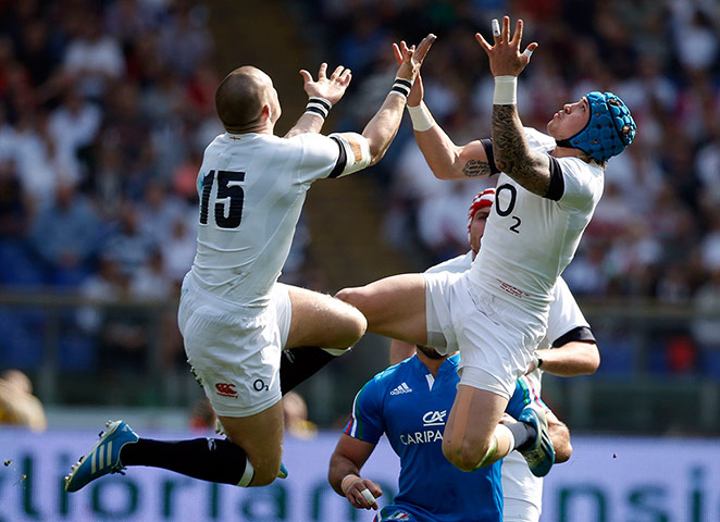 italy v england: England's Mike Brown and Jack Nowell jump for the ball 