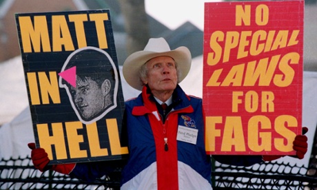 Pastor Fred Phelps Sr displays provocative placards in Laramie, Wyoming in April 1999. Photograph: David Zabulowski/AP