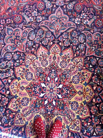 a patterned living room carpet in iran