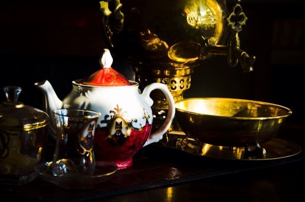 a pot of tea and a glass