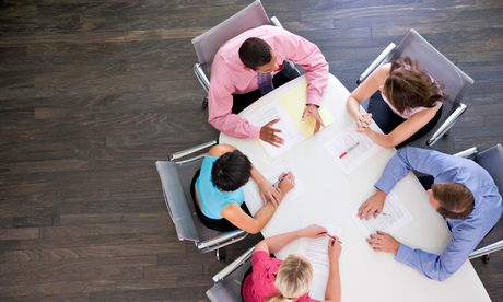Five businesspeople at boardroom table