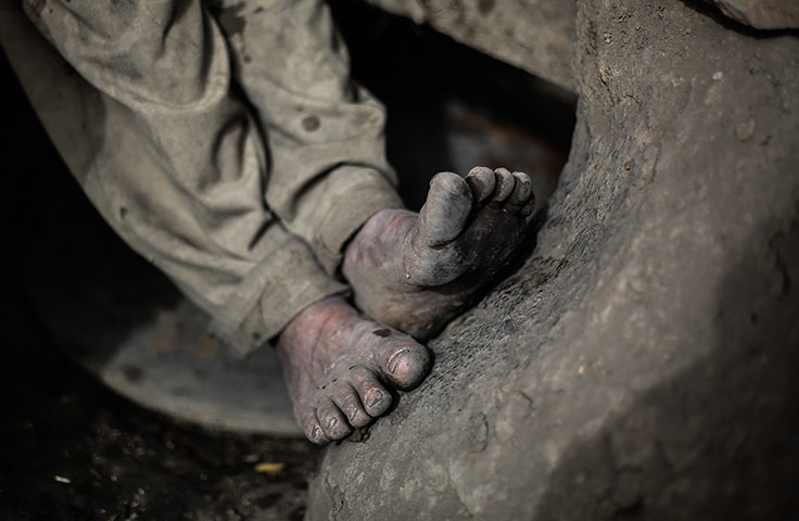 Egypt pottery: A potter's clay-covered feet