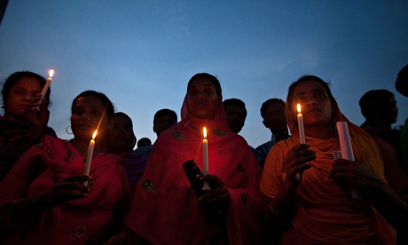 Bangladeshi garment workers and victims' relatives hold a candlelit memorial at the Rana Plaza site