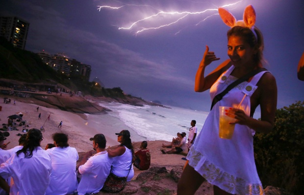 Rio De Janeiro, Brazil: Lightning strikes over Copacabana Beach during the Vem Ni Mim Que Sou Facinha street carnival.