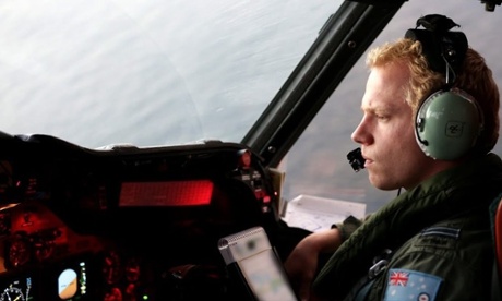 A crew member on board RAAF AP3C Orion aircraft during a search operation for the missing Malaysia Airlines plane in the southern Indian Ocean.  The Australian Marine Safety Authority is coordinating the search in a vast area west of Perth.