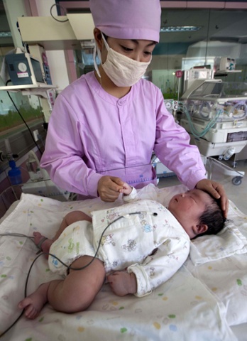 A newborn weighing in at a whopping 13.8lb in Changchun, China.