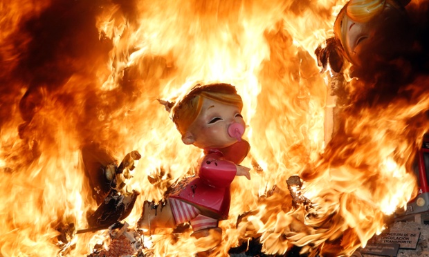 Satirical sculptures burn during the traditional Fallas festival in Valencia, Spain.