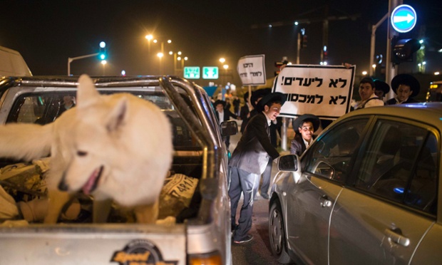Ultra-Orthodox Jews block a road during a protest in the city of Ashdod.