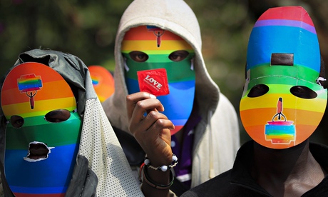 Masked Kenyans protest against Uganda's anti-gay bill at the Ugandan High Commission in Kenya