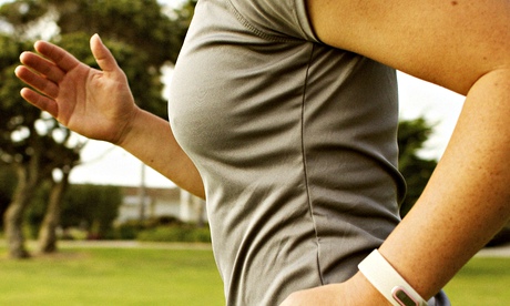Hispanic woman running in park field