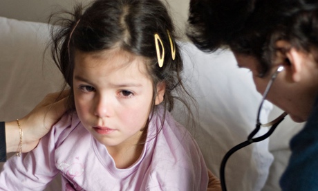 GP examines sick child