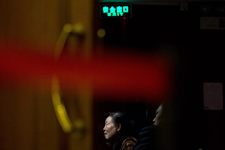 20 Photos: Relatives of passengers on the Malaysia Airlines Flight MH370 in Beijing