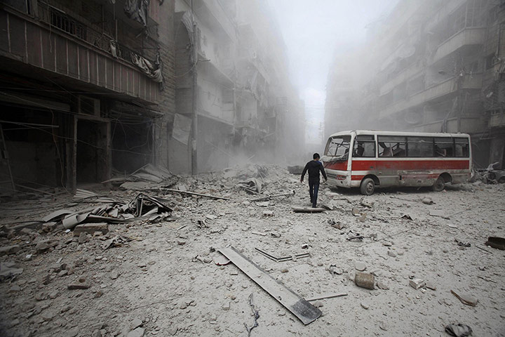 20 Photos: A man inspects the damage caused by bombs in Aleppo