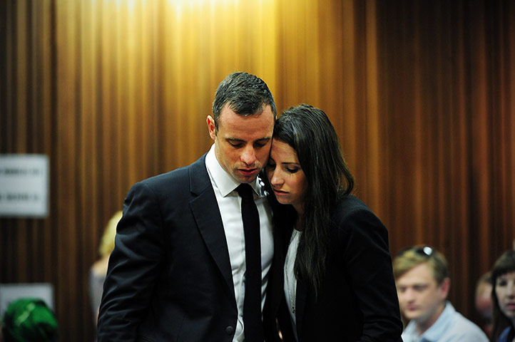 20 Photos: Oscar Pistorius stands beside his sister at the North Gauteng High Court