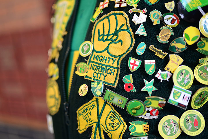 saturday roundup: Badges on a Norwich City fan's jacket 