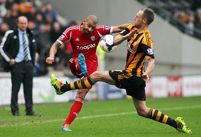 saturday round up: David Meyler of Hull City attempts to block Steven Reid's cross