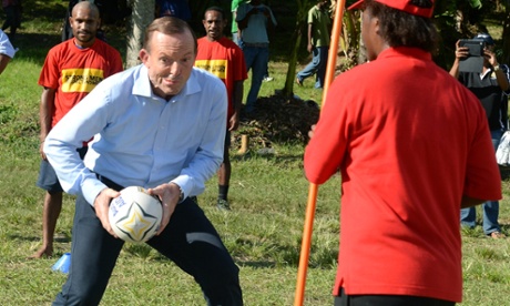Prime Minister Tony Abbott takes part in rugby league training at Port Moresby, City Mission, Saturday, March, 22, 2014. Mr Abbott made a three day state visit to Papua New Guinea.