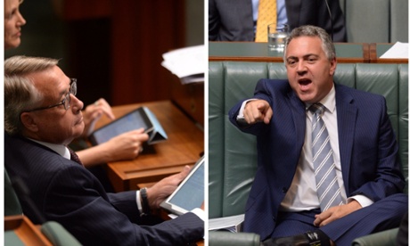 Treasurer Joe Hockey (right) and former Treasurer Wayne Swan reacting during House of Representatives Question Time in Canberra, Monday, March 24, 2014.