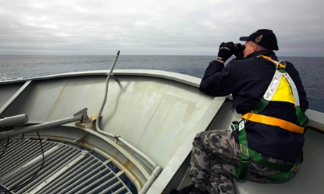 Able Seaman Kurt Jackson keeps watch on the forecastle of the Australian Navy ship, the HMAS Success, in a search area for missing Malaysian Airlines Flight MH370.