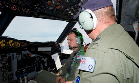 Flight Lieutenant Josh Williams (left) discusses fuel consumption with flight engineer Warrant Officer Neil Scott-Jackson while on route to the southern Indian Ocean.