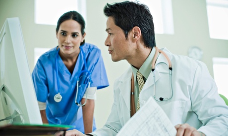 Doctors Looking at Computer