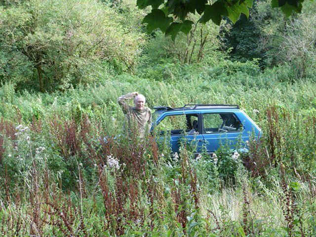 In Pictures - Lost: man looking lost next to car