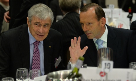 Prime Minister Tony Abbott speaks to Kerri Stokes at the Asia Society Australia lunch at the Realm Hotel in Canberra, Tuesday, March 25, 2014.