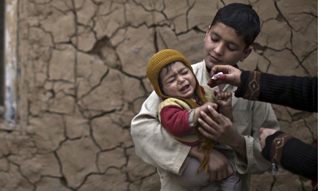 A children receives a polio vaccine in Islamabad