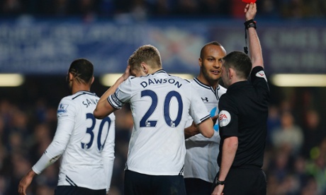 Michael Oliver brandishes a red card