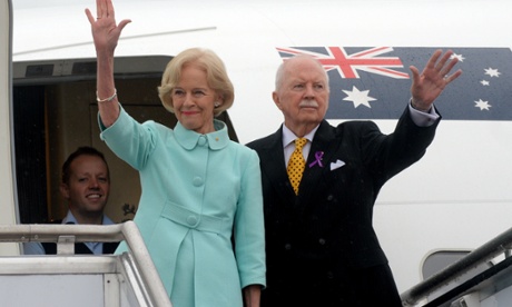 Governor General Dame Quentin Bryce and Michael Bryce wave goodbye as they board the plane at Fairbairn RAAF base in Canberra, Wednesday, March. 26, 2014.