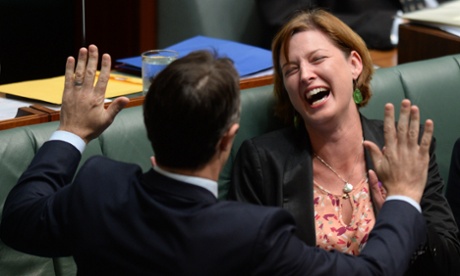 Labor MPs Julie Collins and Jason Clare share a light moment during House of Representatives Question Time at Parliament House in Canberra, Wednesday, March 26, 2014.