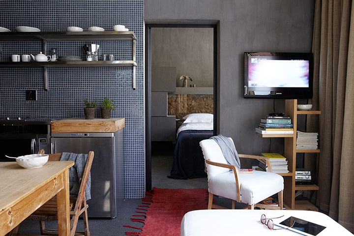 Homes - small spaces: interior of room with dark walls and wooden furniture