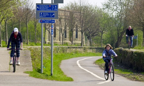 Cyclists on the Sustrans cycle path way at the former Mangotsfield Railway Station part of National Cycle Network near Bristol.
