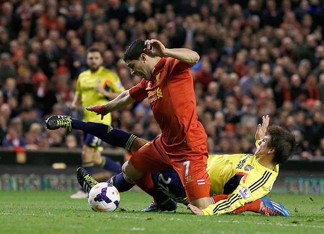 Liverpool Sunderland: Liverpool's Suarez is fouled Sunderland's Vergini