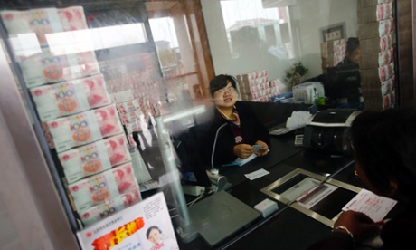 Cash stacked up at Jiangsu Sheyang Rural Commercial Bank in Yancheng, Jiangsu province, to show it has not run out of money.