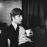 Jane Bown: John Lennon with cup 1963