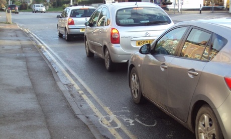 Cars queueing at a junction.