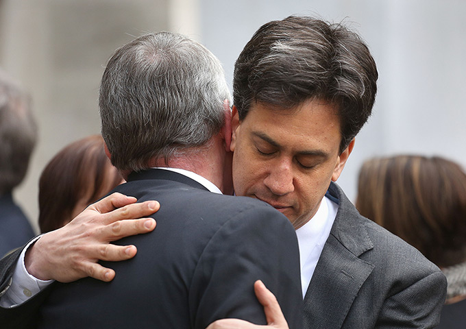 Tony Benn's funeral: Hilary Benn is hugged by Ed Miliband after the funeral