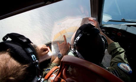 An Australian air force crew in the cockpit of an Orion plane searching for flight MH370 in the Indian Ocean.