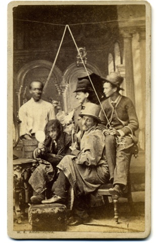 A carte de visite of an amateur theatrical group presenting a mock lynching, c1880