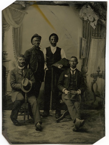 A tintype of four men with blacked faces, 1880s.