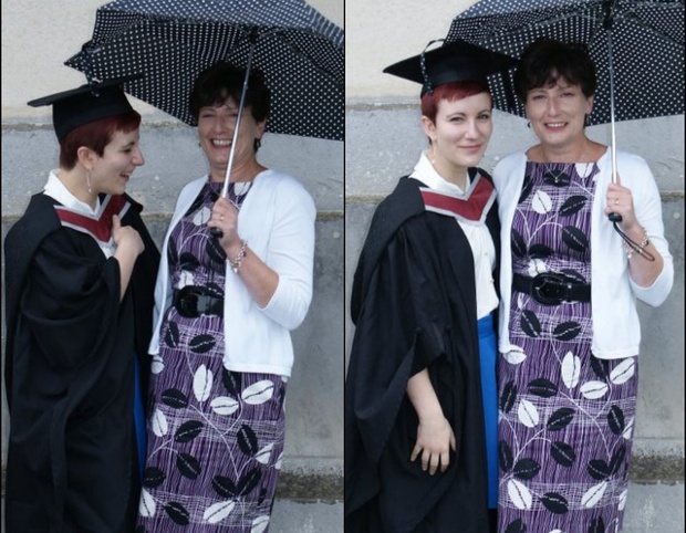 Mum and daughter under umbrellas